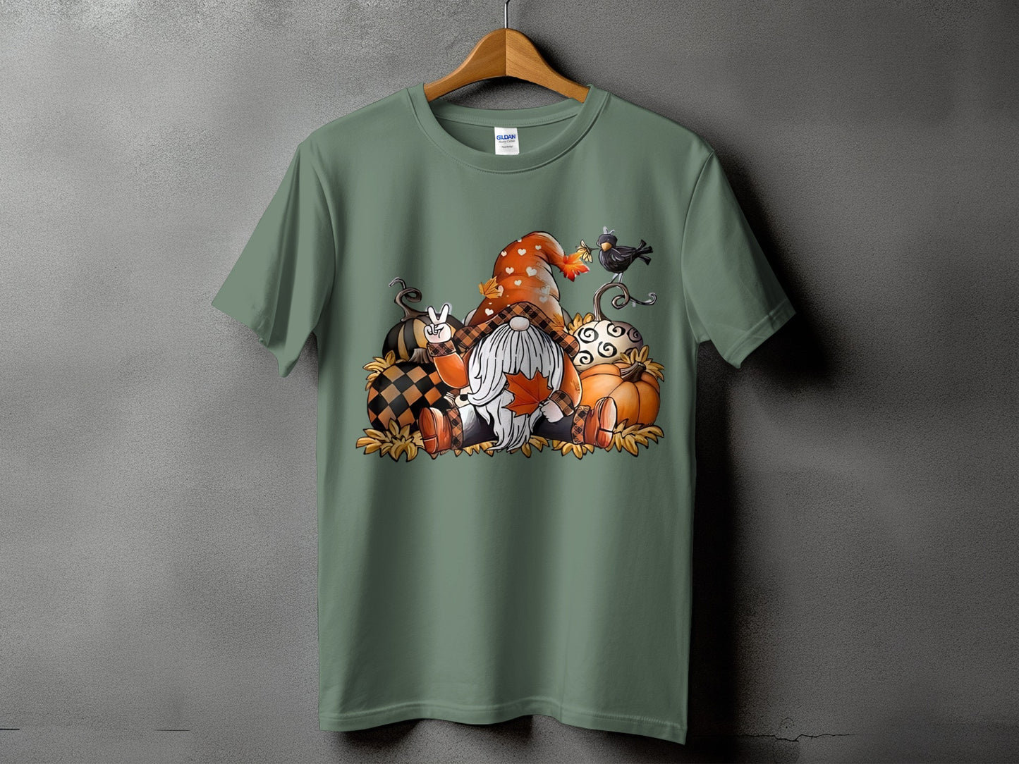 Gnome and pumpkins graphic on a green t-shirt.