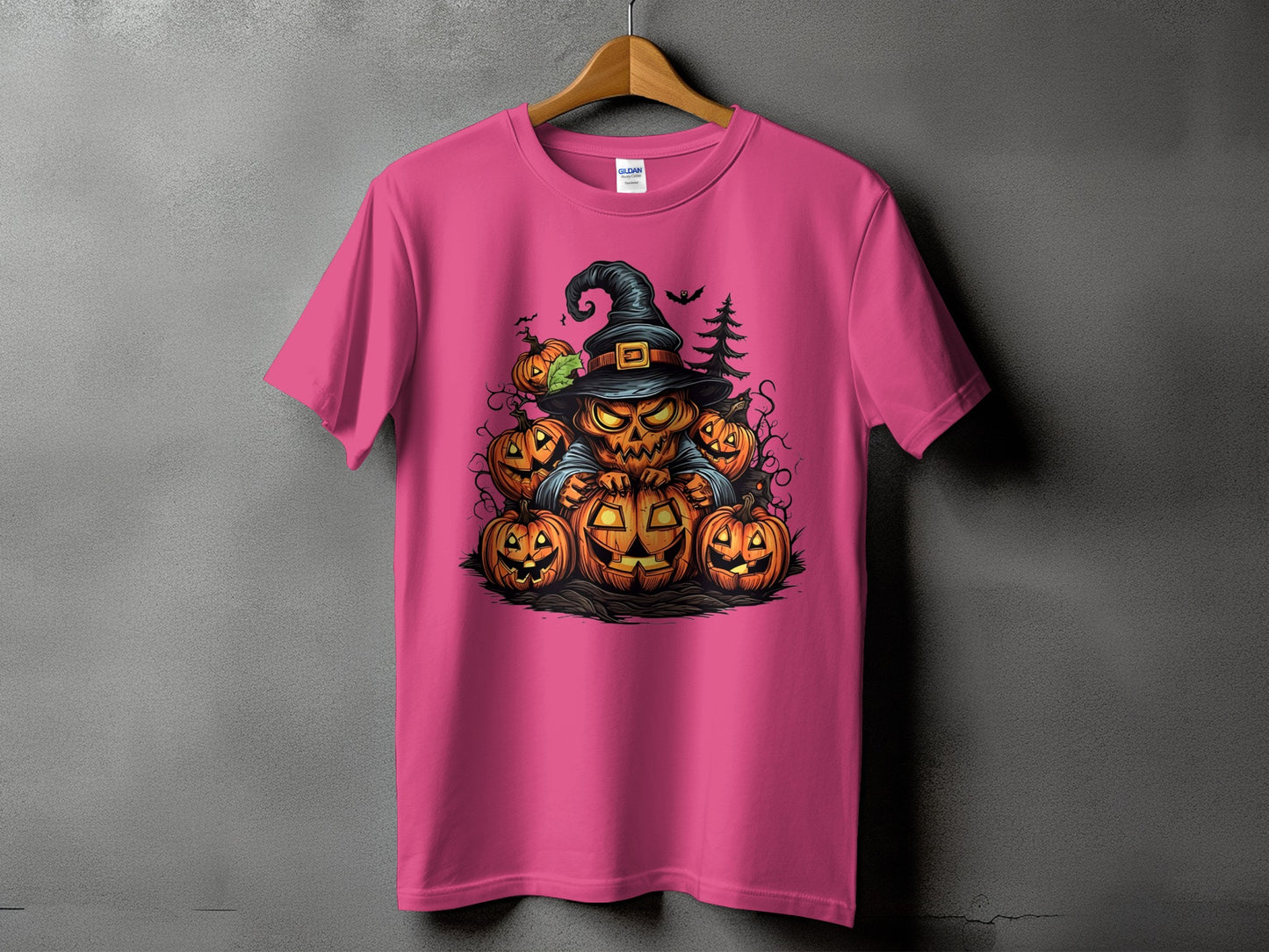 Pink t-shirt with a cartoon pumpkin wizard surrounded by jack-o'-lanterns.