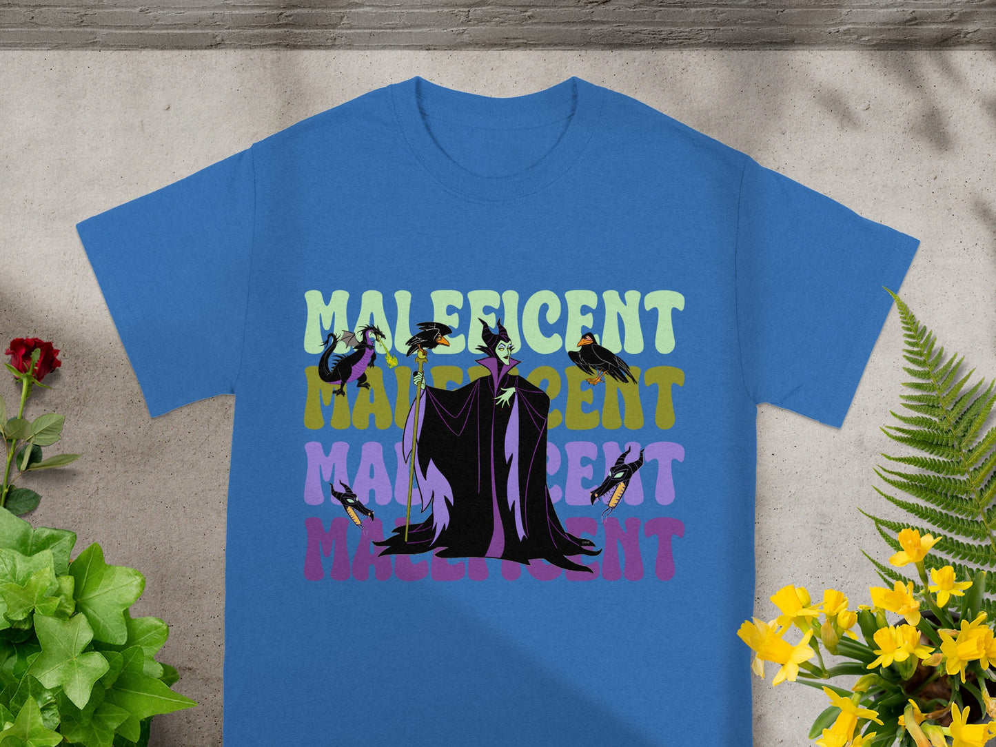 Maleficent graphic t-shirt in blue with text and character graphic.