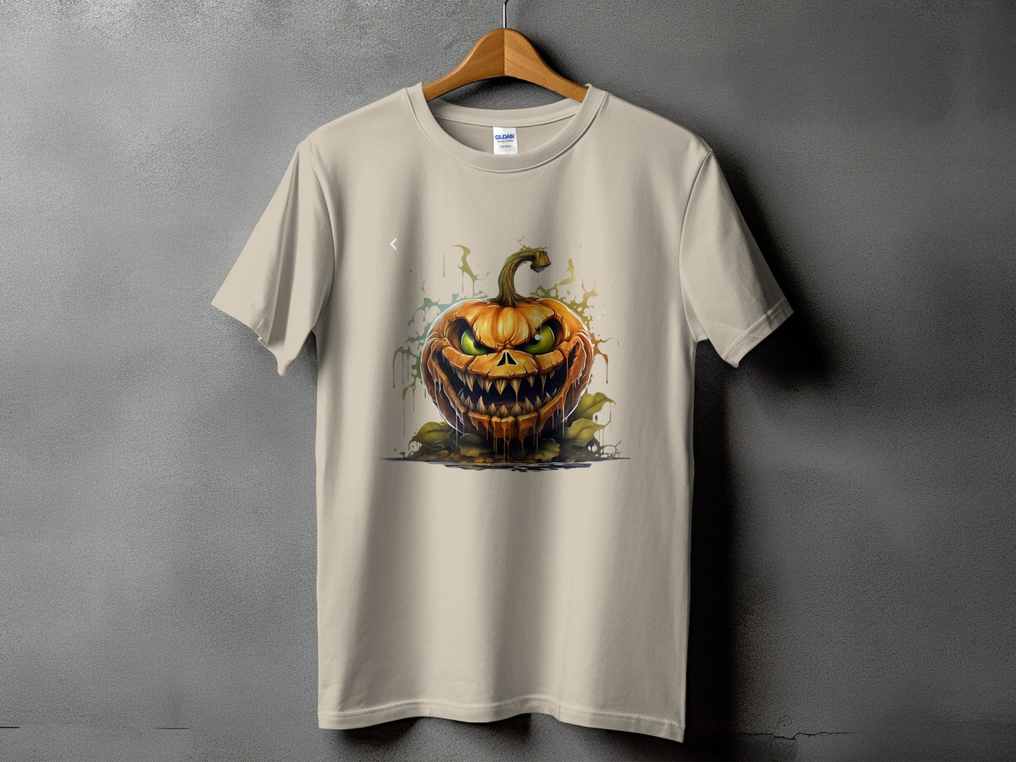 Light tan t-shirt featuring a scary, dripping jack-o'-lantern design.