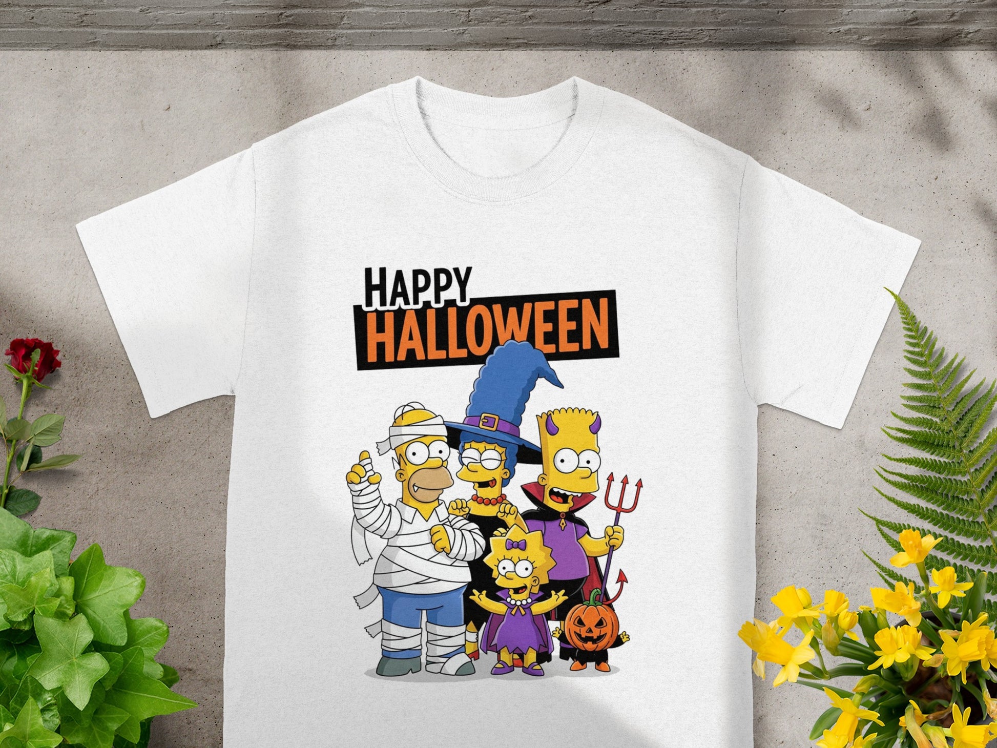 The Simpsons family in Halloween costumes with "Happy Halloween" text.