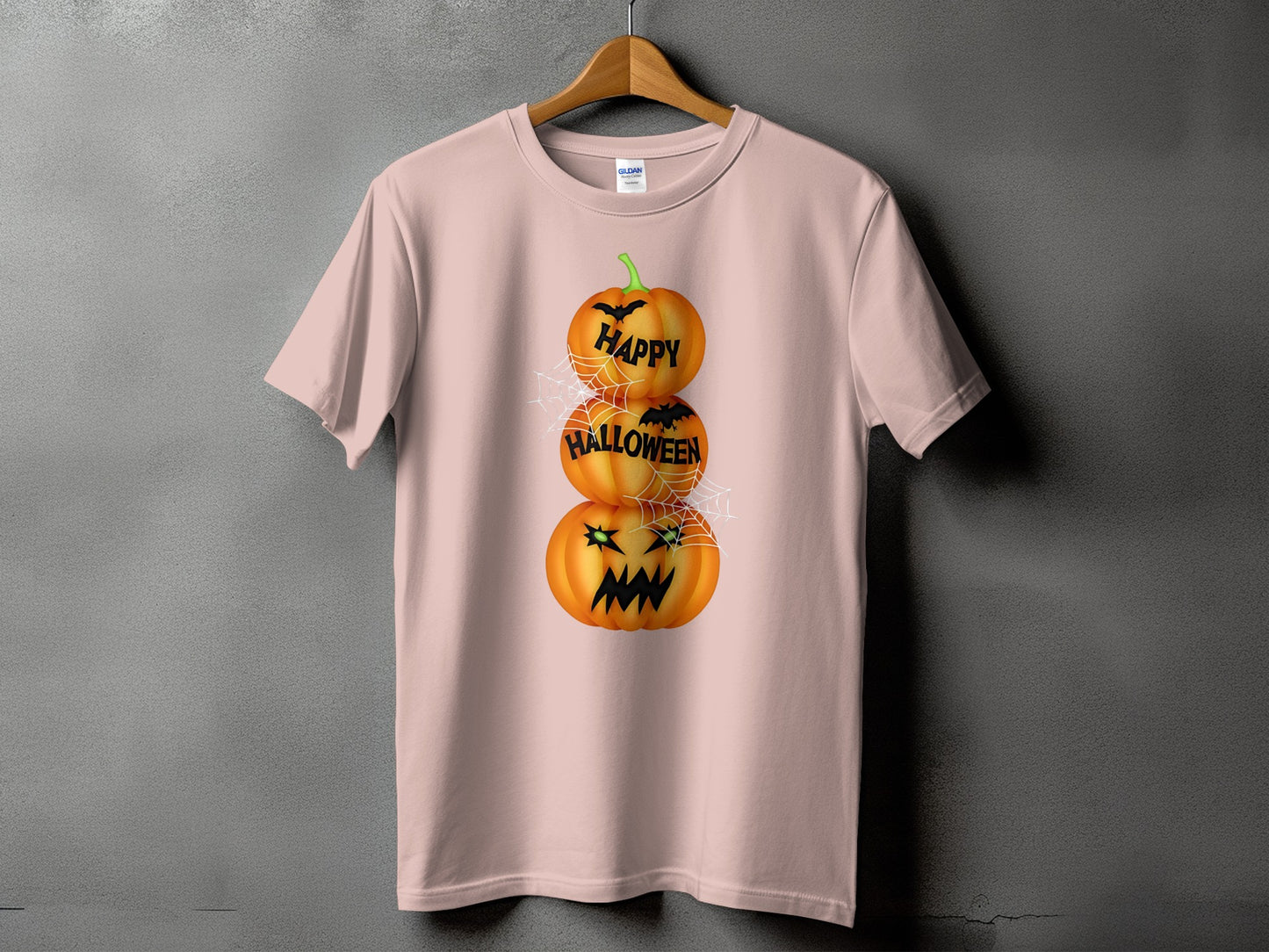 Pink t-shirt with stacked pumpkins saying "Happy Halloween" and bats.