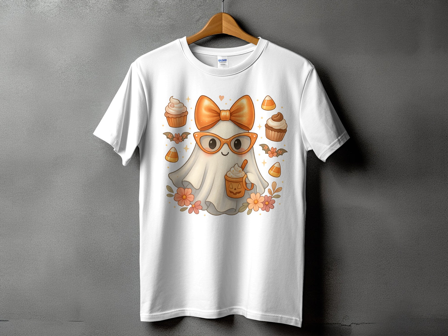 White t-shirt with a cute ghost character wearing glasses and holding a pumpkin spice latte.