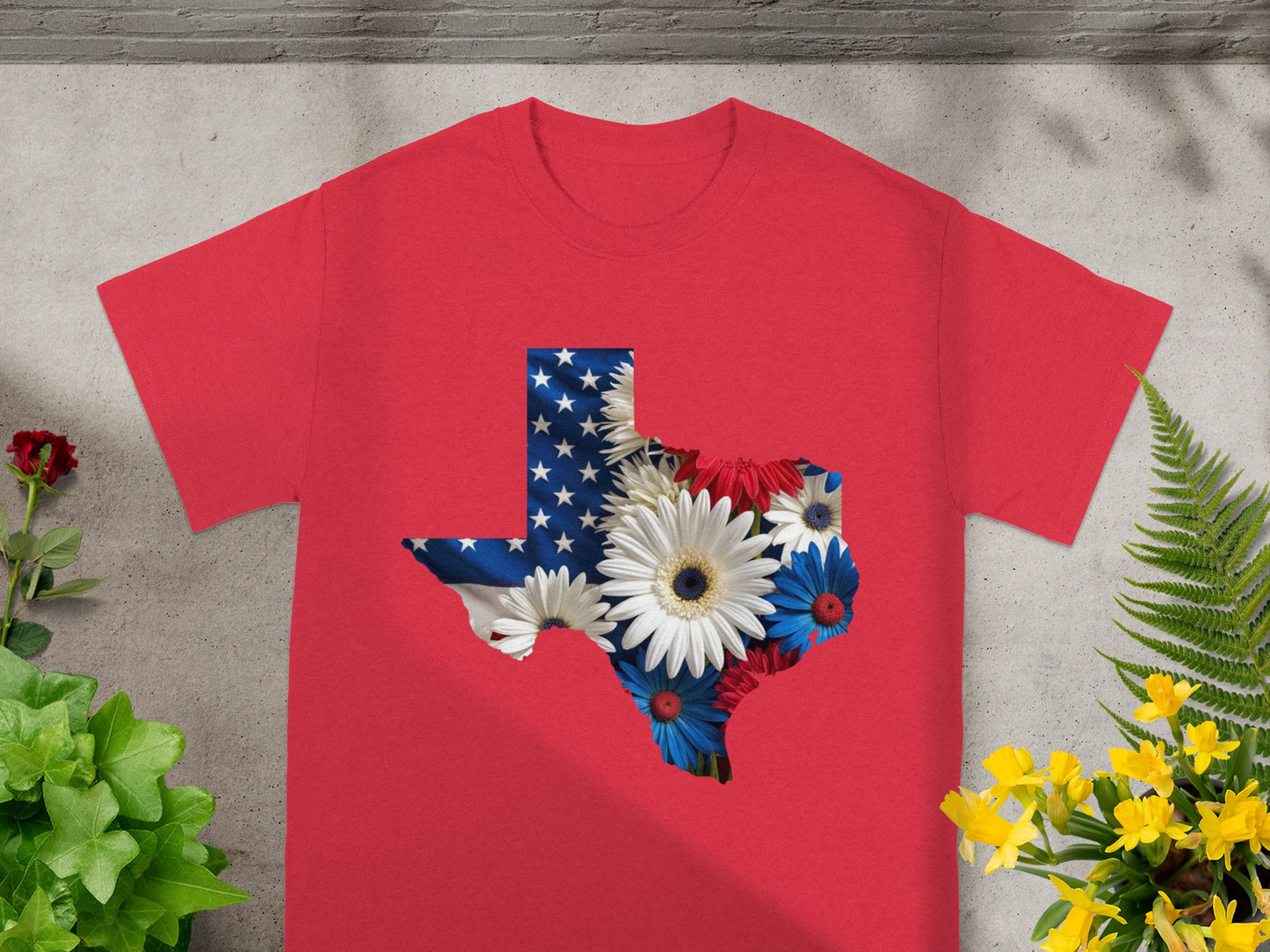 Red t-shirt with Texas shape filled with American flag and flowers.