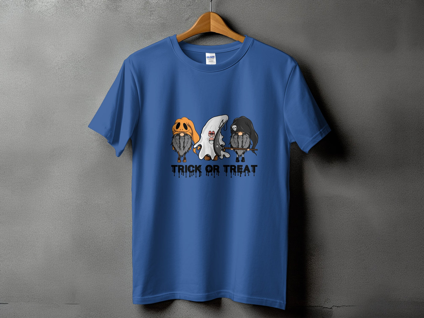 Blue t-shirt with three gnomes in Halloween costumes and "Trick or Treat" text.