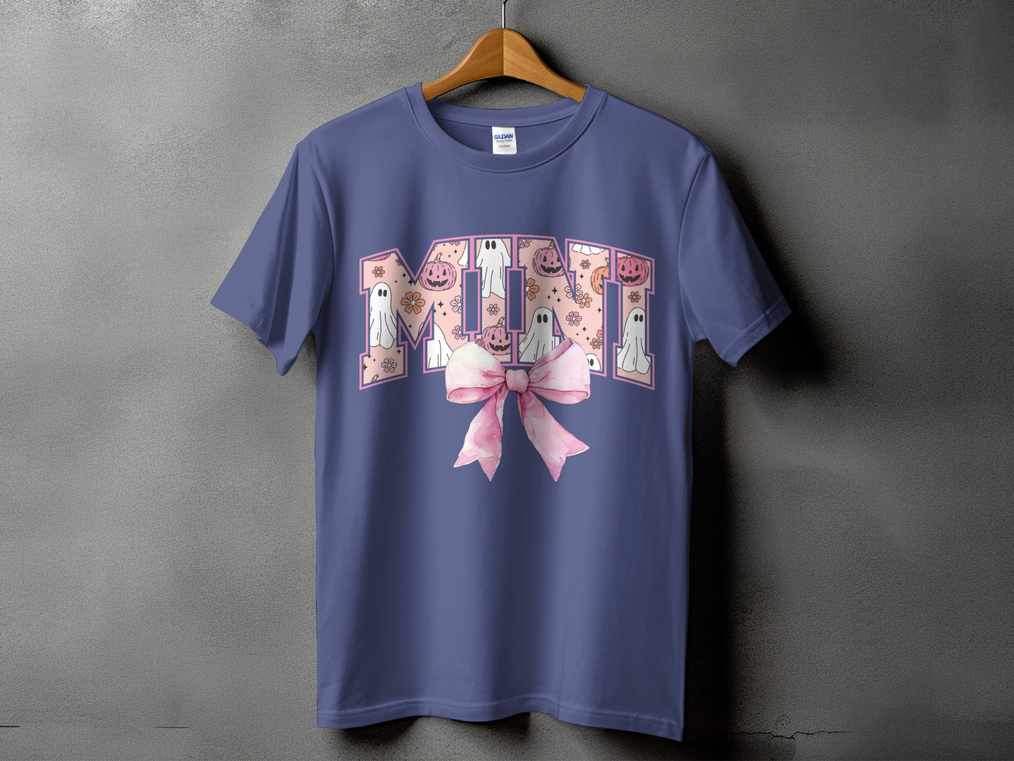 Purple t-shirt with "Mimi" in Halloween ghost and pumpkin pattern, with pink bow.