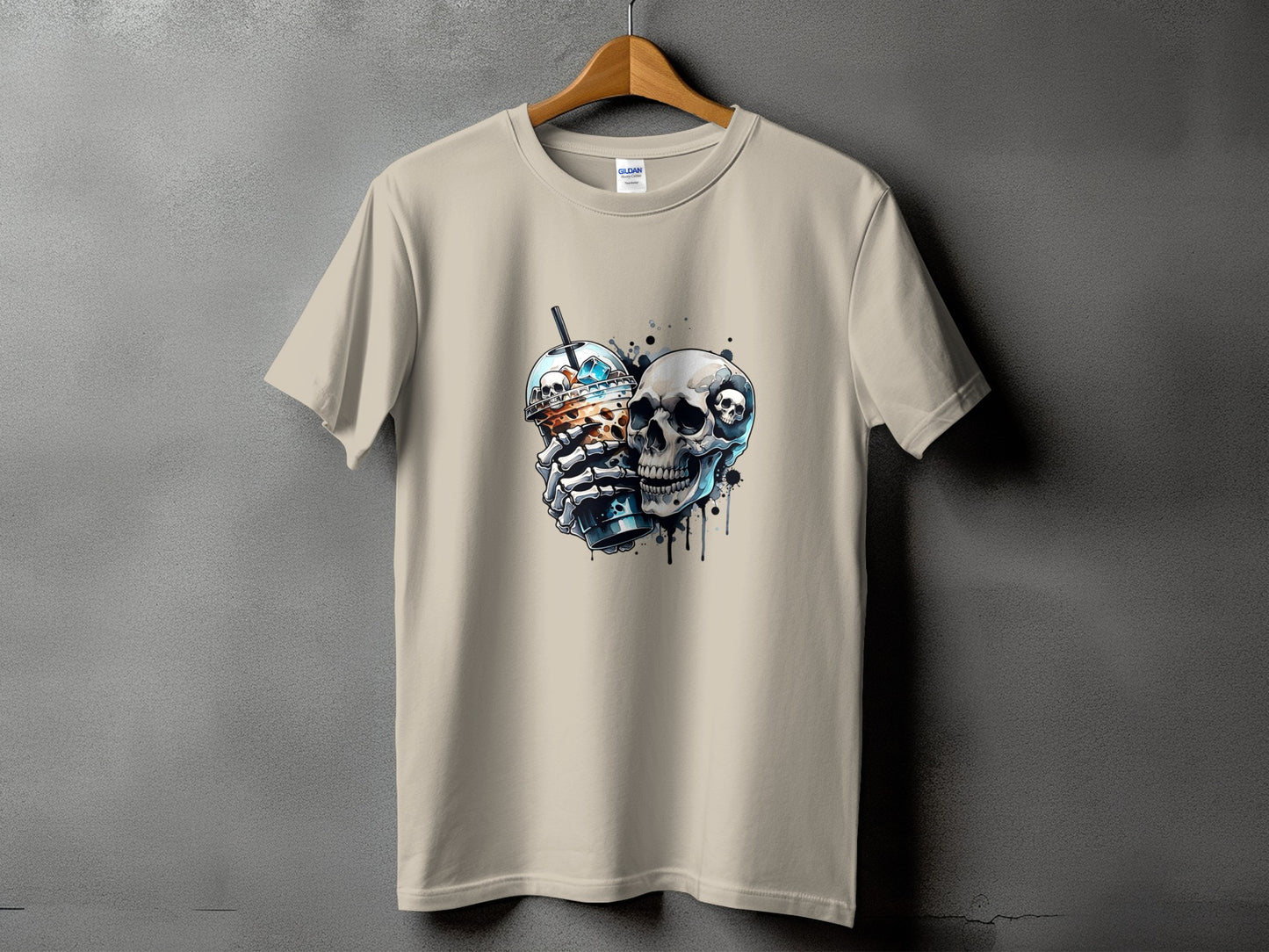 Light tan t-shirt with a graphic of a skull holding a coffee drink.