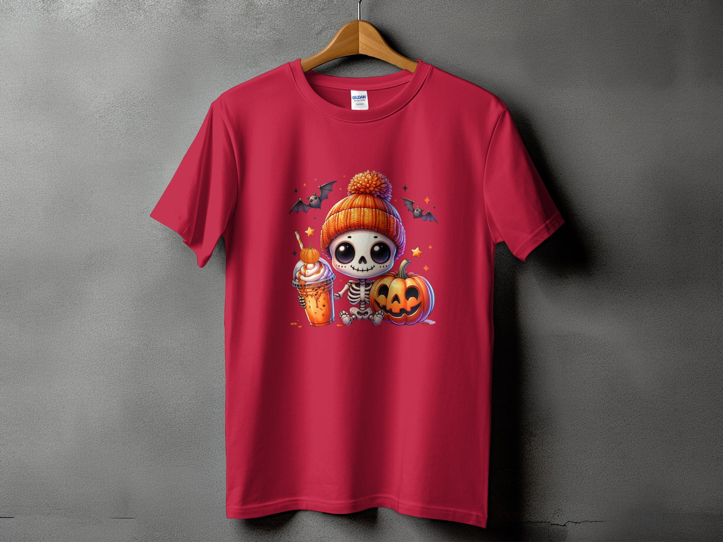 Red t-shirt with a cute skeleton, pumpkin, and beverage Halloween graphic.
