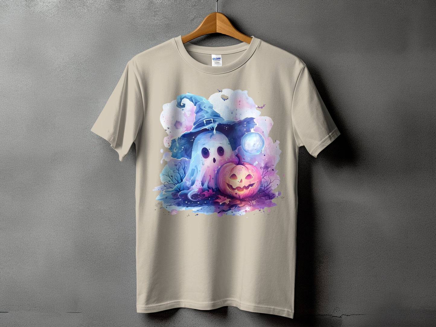 Ghost and pumpkin Halloween graphic on a tan t-shirt.