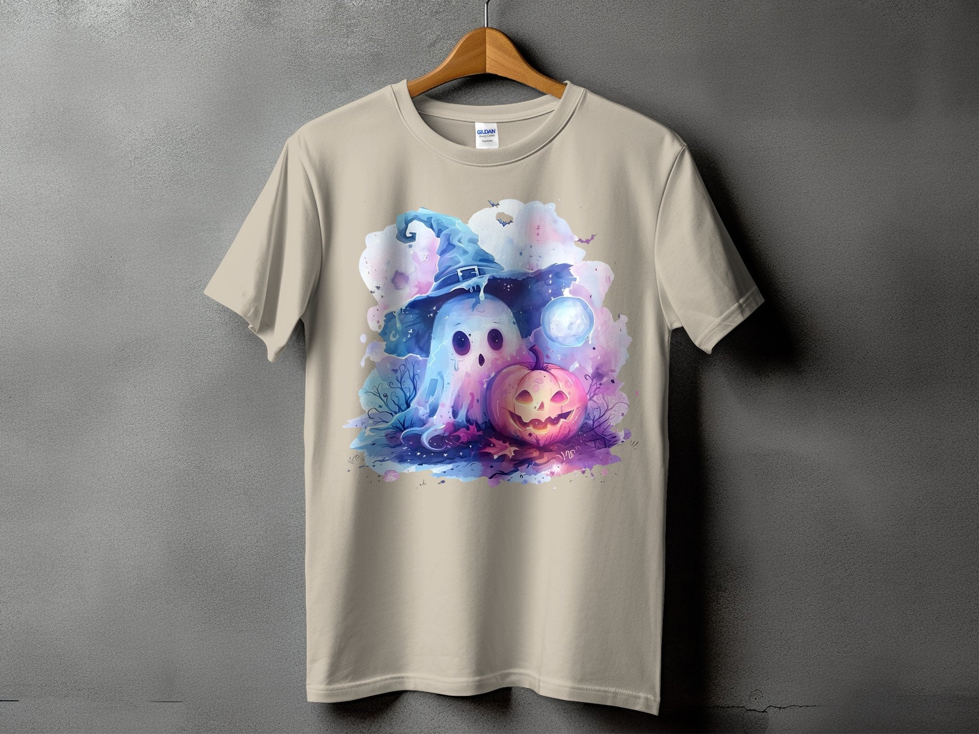 Ghost and pumpkin Halloween graphic on a tan t-shirt.