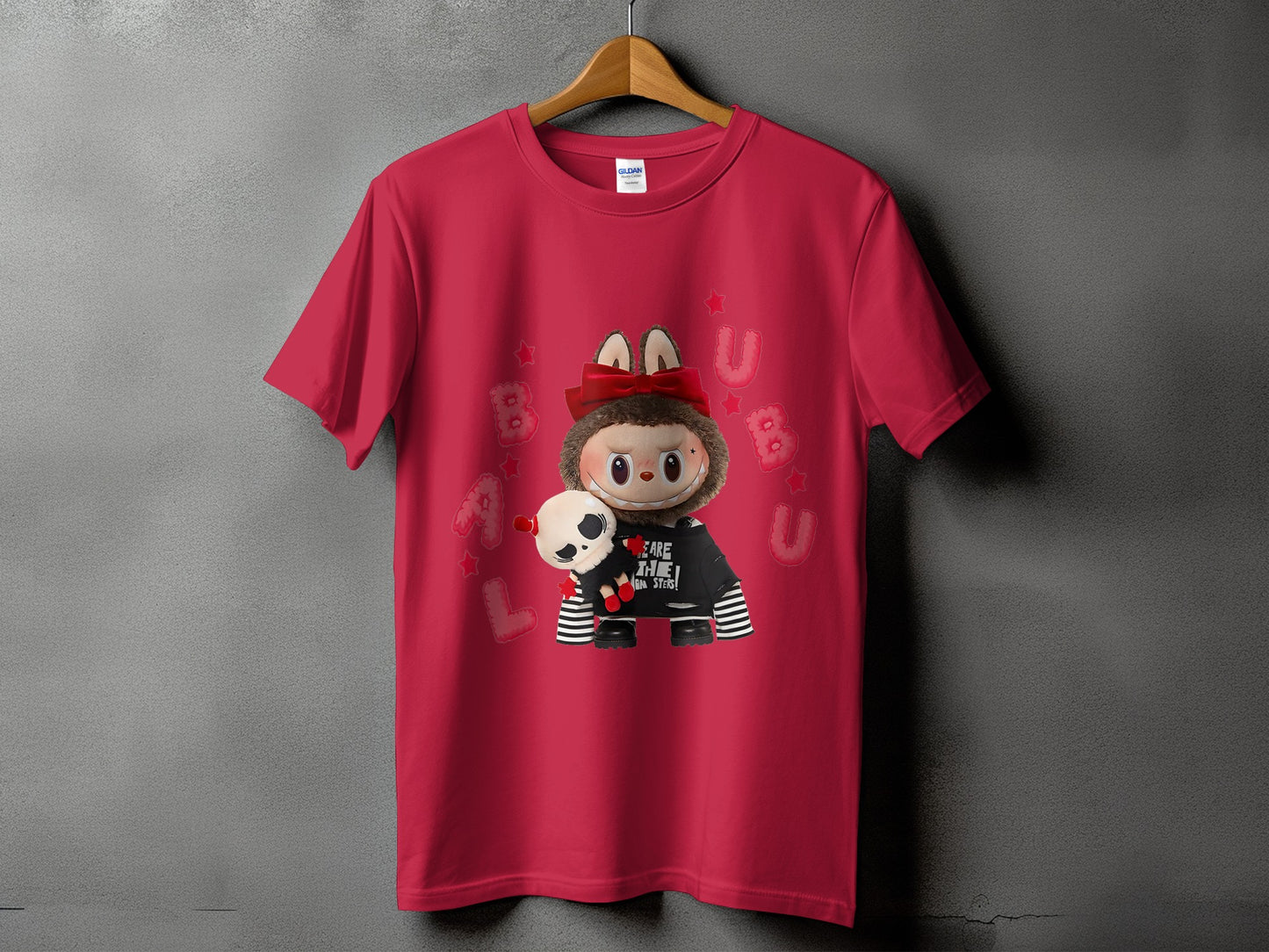 Red t-shirt with graphic of a character holding a plush toy and text "BEWARE THE MONSTERS".
