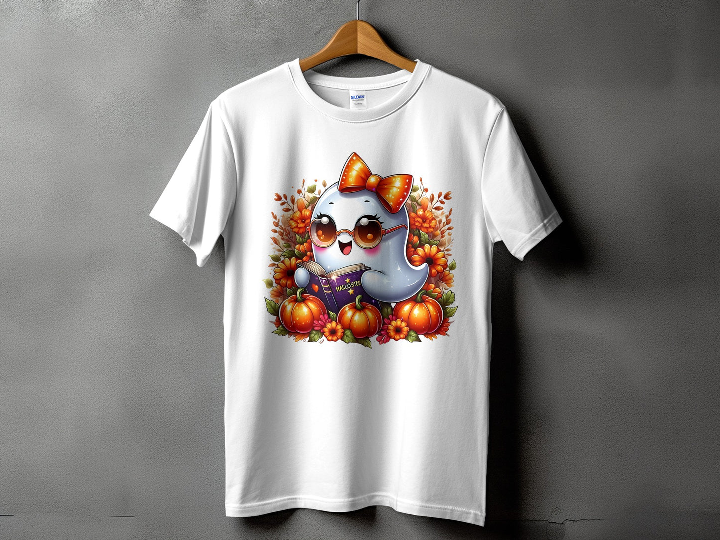White t-shirt featuring a cartoon ghost wearing glasses and reading a book.