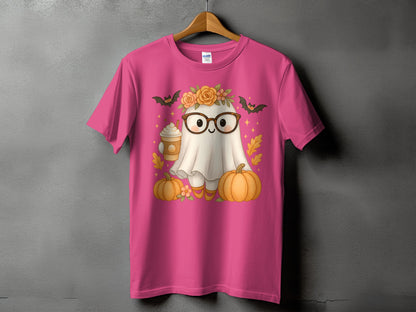 Pink t-shirt with a ghost wearing glasses and holding a coffee, surrounded by pumpkins.