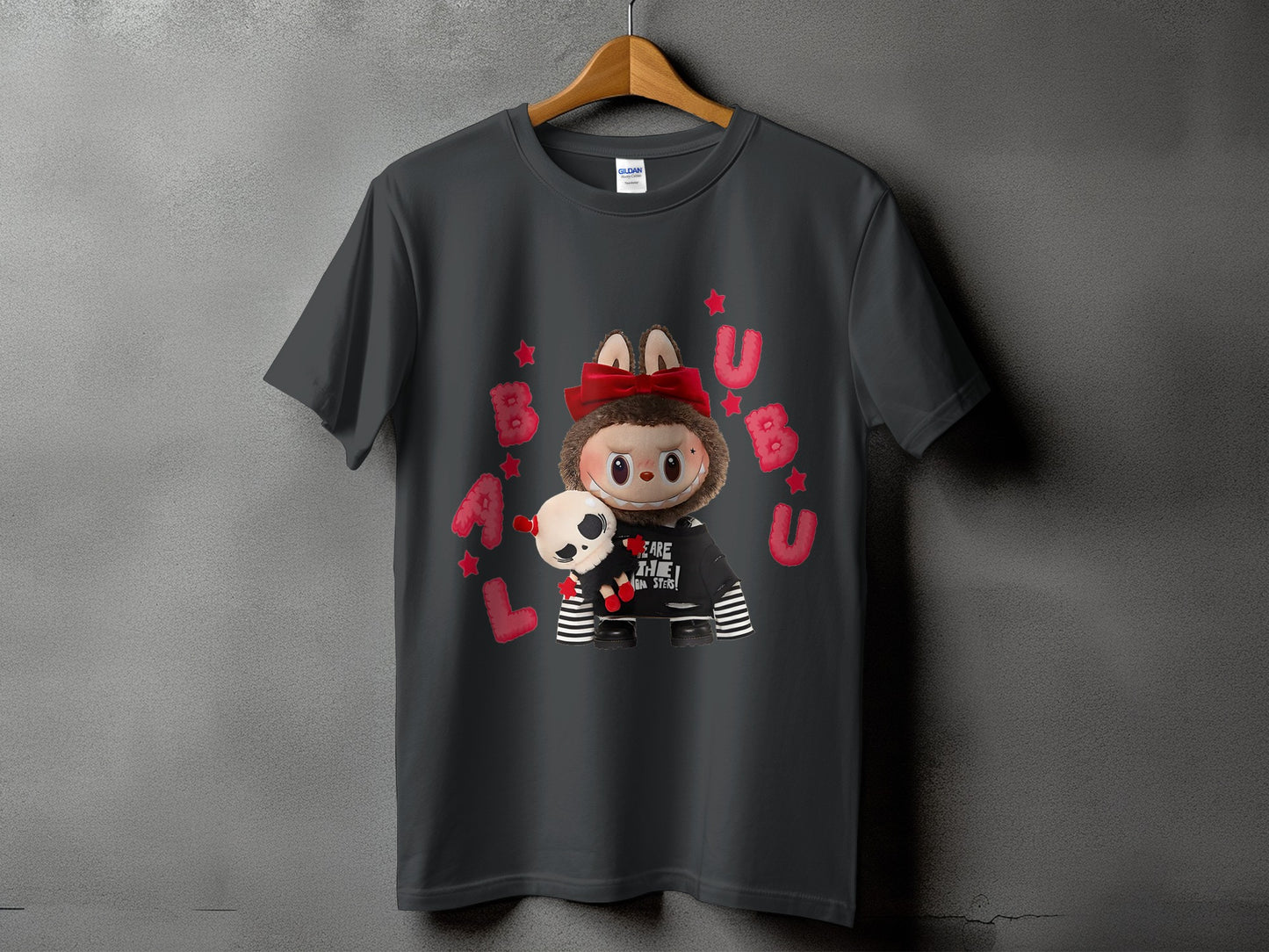 Dark grey t-shirt with a cartoon character holding a skull and stars.
