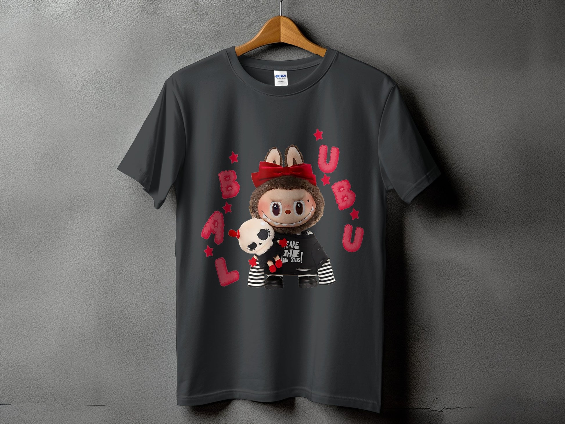 Dark grey t-shirt with a cartoon character holding a skull and stars.