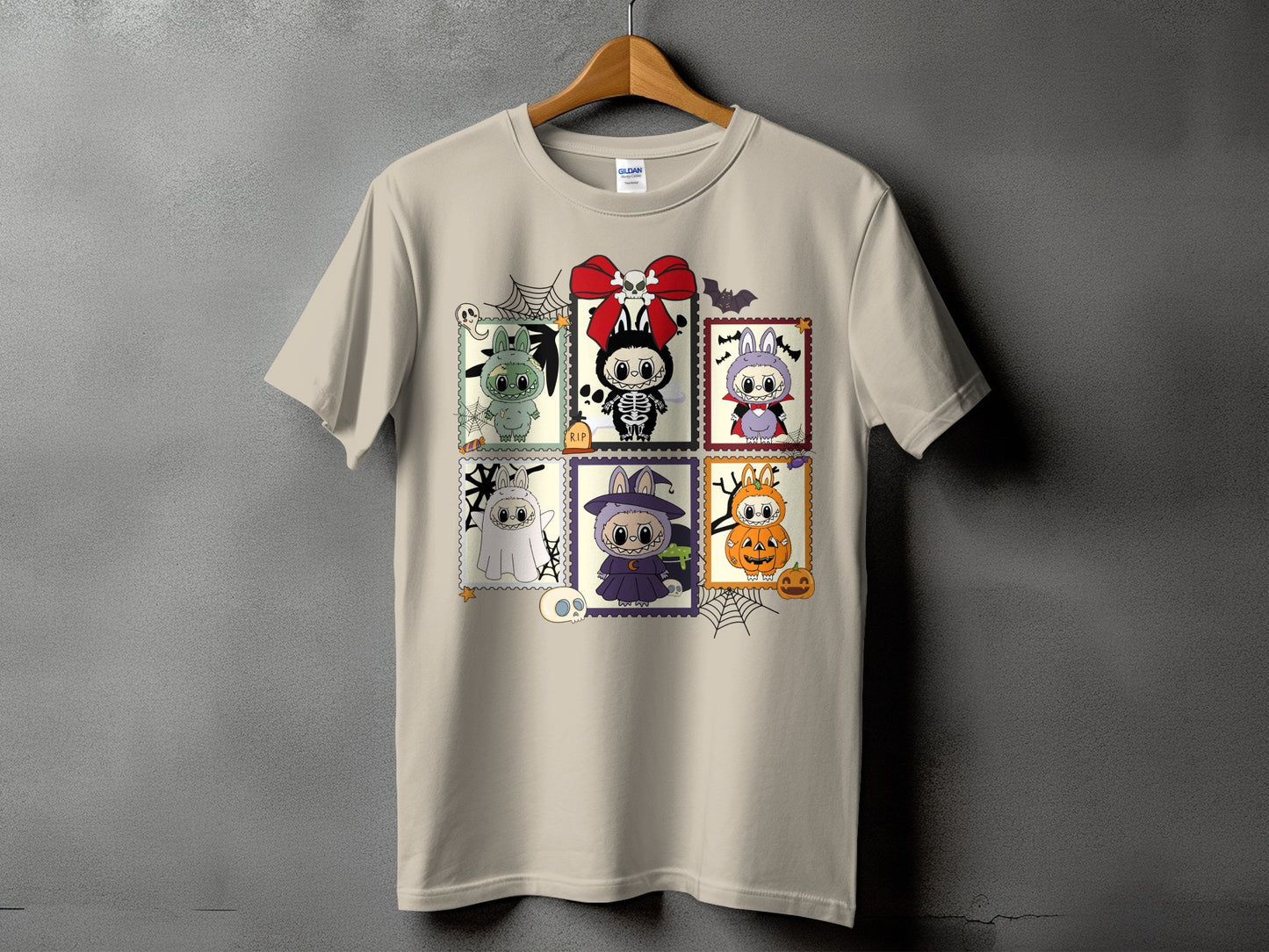 Beige t-shirt with six Halloween-themed cartoon character stamps.