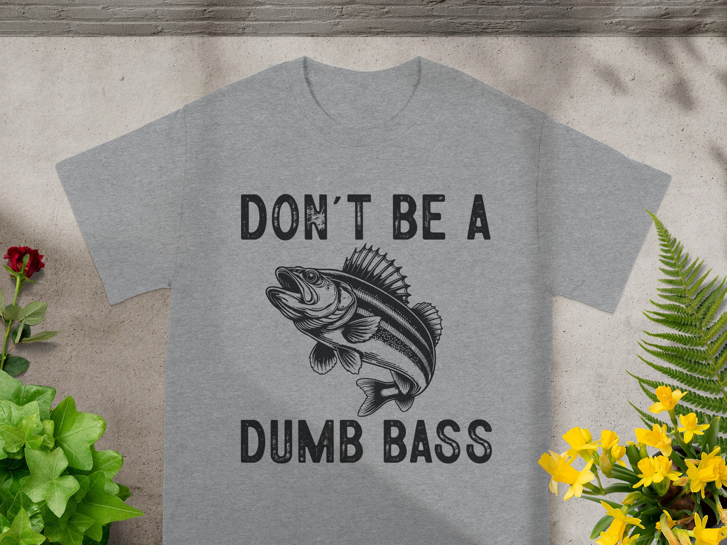 Grey t-shirt with black graphic of fish and text "DON'T BE A DUMB BASS".