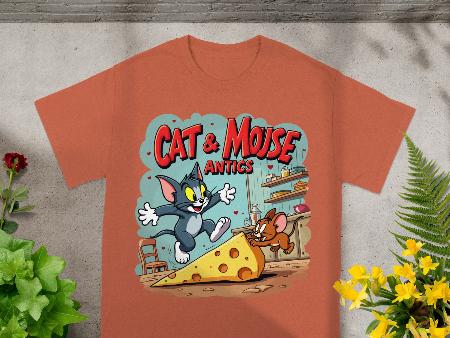 Cartoon t-shirt graphic with Tom and Jerry chasing cheese.