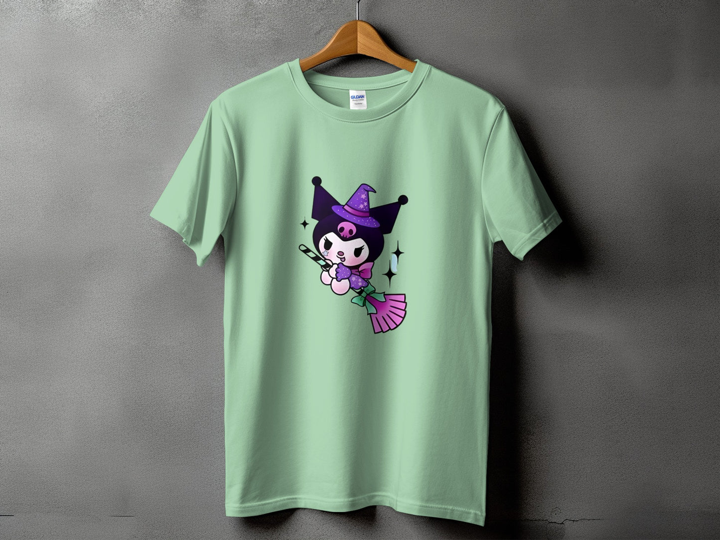 Mint green t-shirt with Kuromi character flying on a broomstick