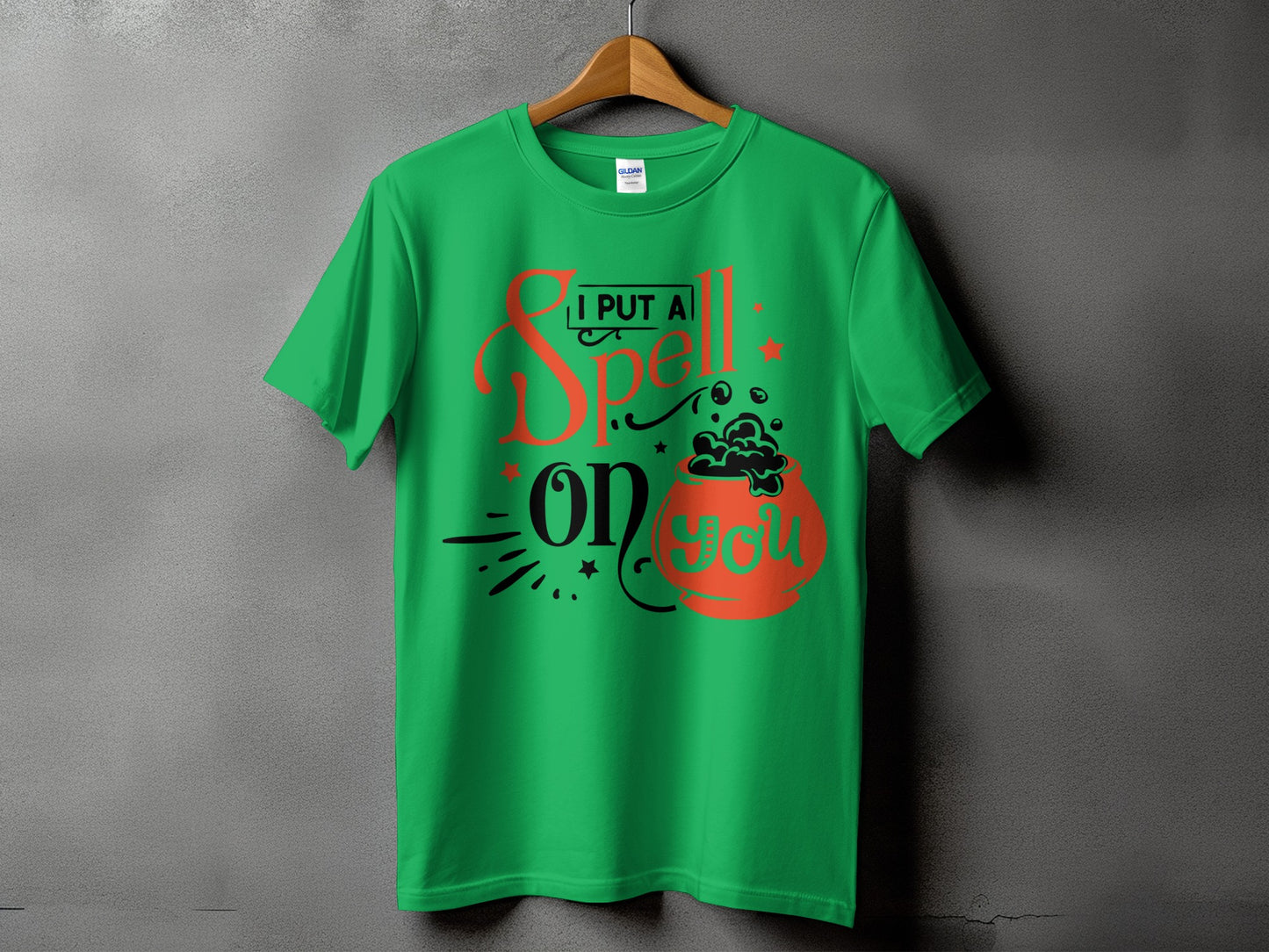 Green t-shirt with "I Put A Spell On You" Halloween graphic.