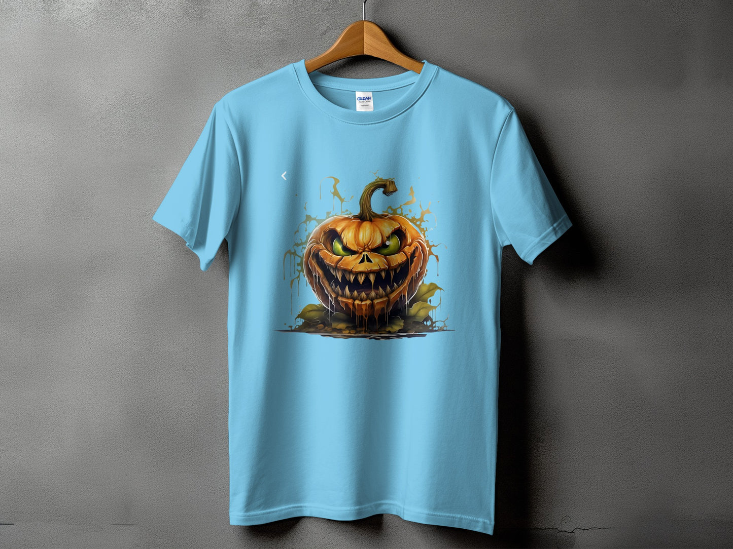 Light blue t-shirt with a spooky, detailed jack-o'-lantern graphic and dripping orange accents.