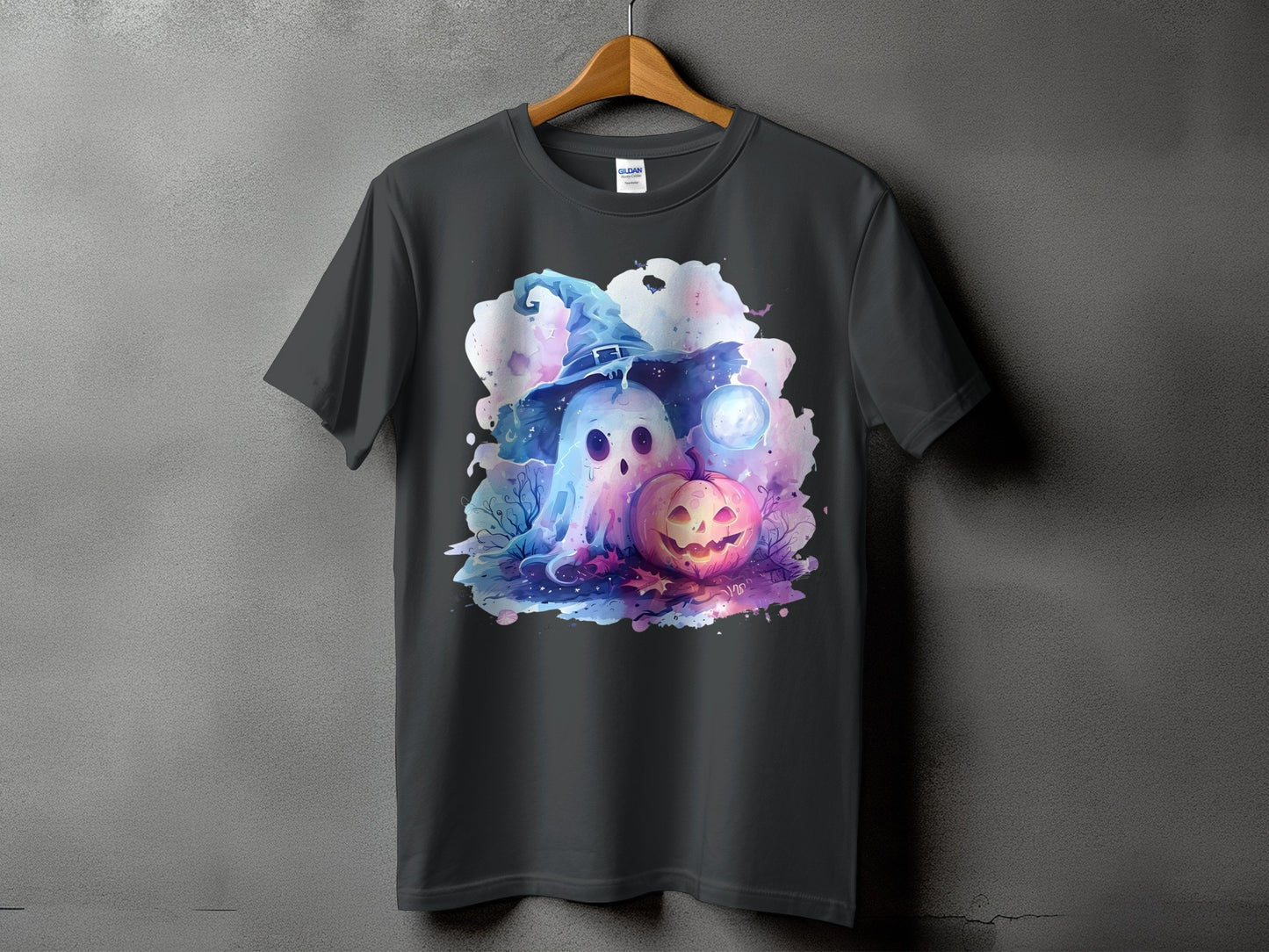 Dark gray t-shirt with a watercolor graphic of a ghost in a witch hat and a jack-o'-lantern.