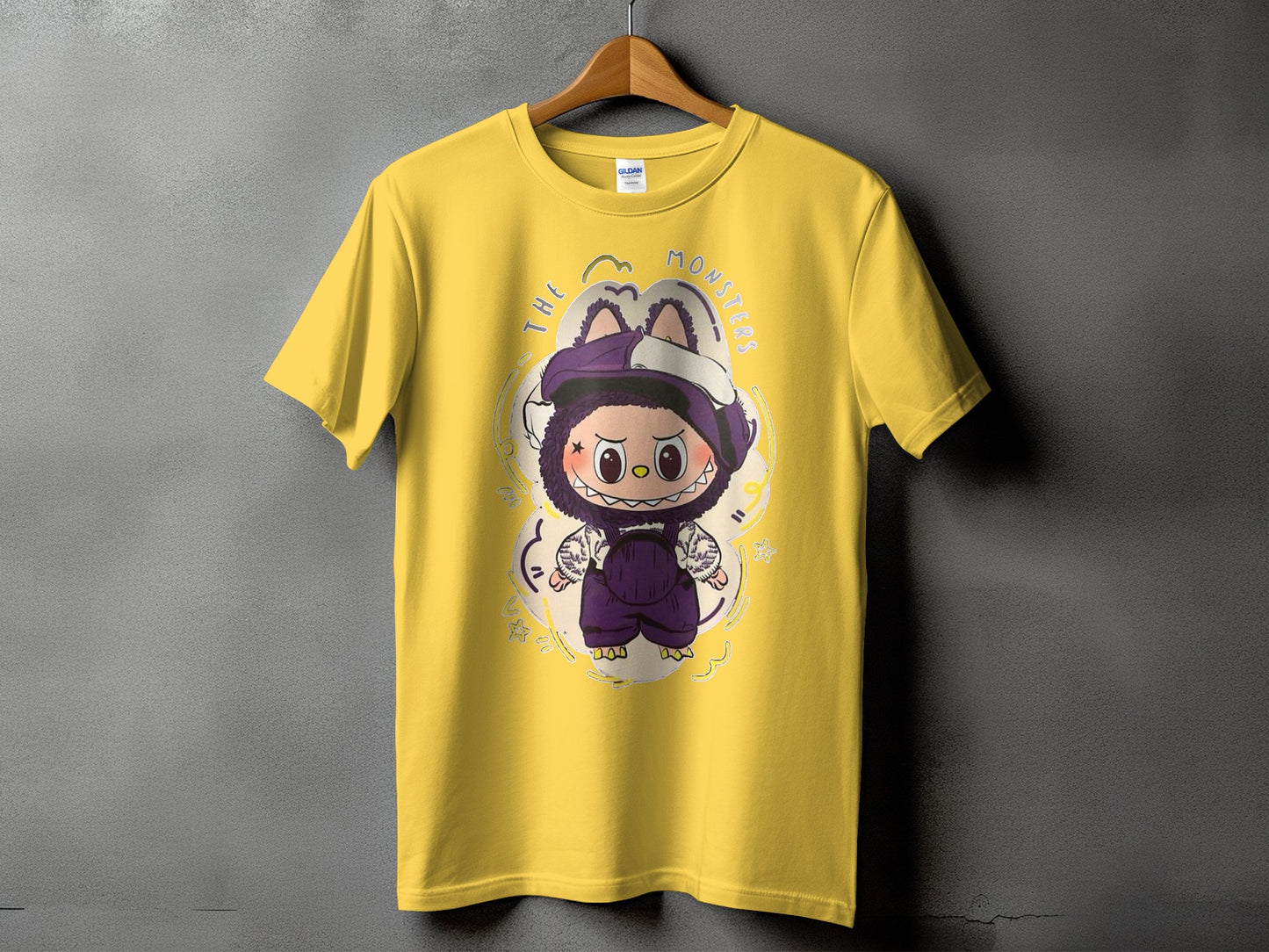 Yellow t-shirt with "The Monsters" text and a cartoon character graphic.