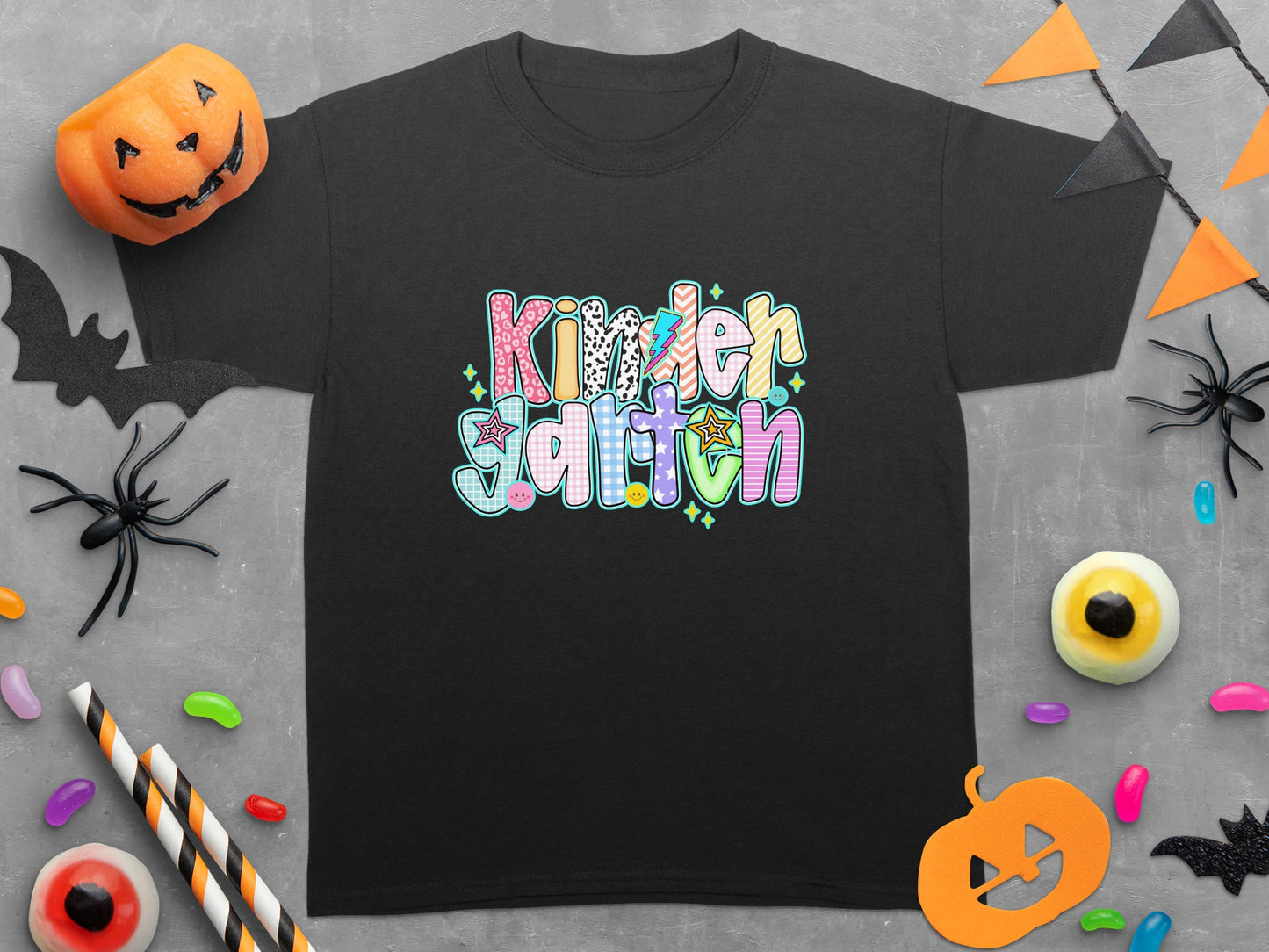 Black t-shirt with colorful "Kindergarten" text and Halloween decorations