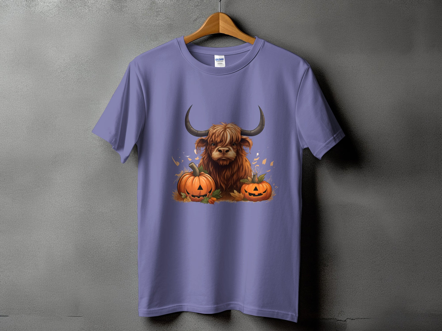 Purple t-shirt with a Highland cow and jack-o'-lanterns Halloween graphic.