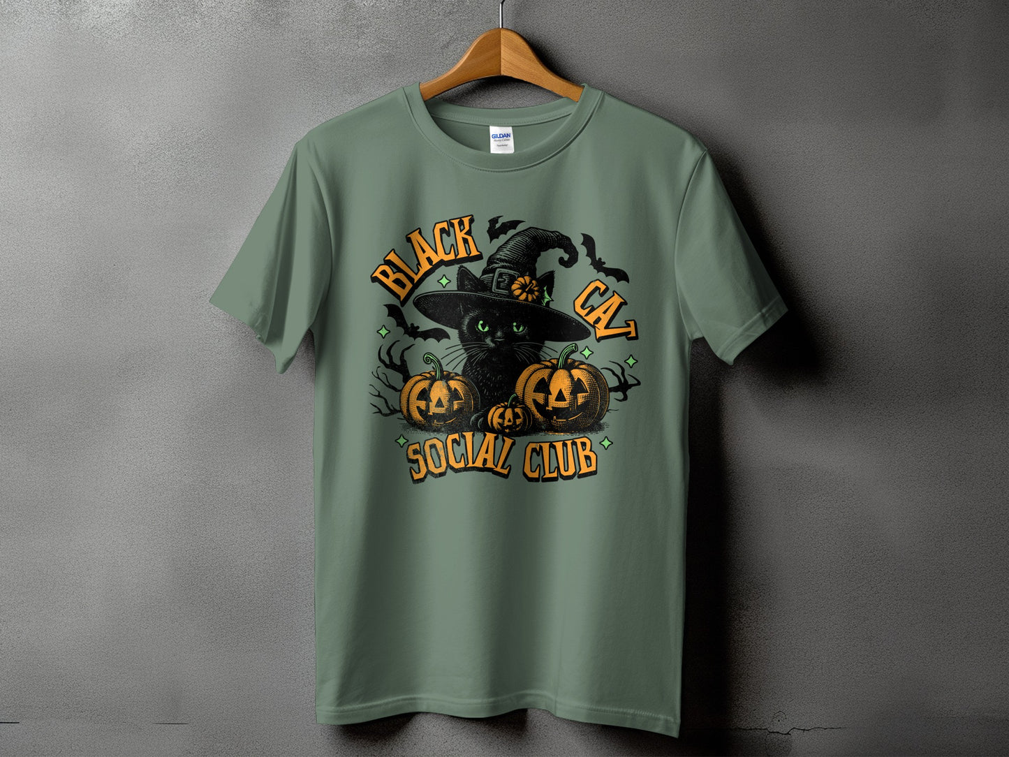 Green t-shirt with black cat, pumpkins, bats, and text "Black Cat Social Club".