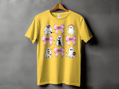 Yellow t-shirt with a grid of ghosts, pink bows, and a black cat.