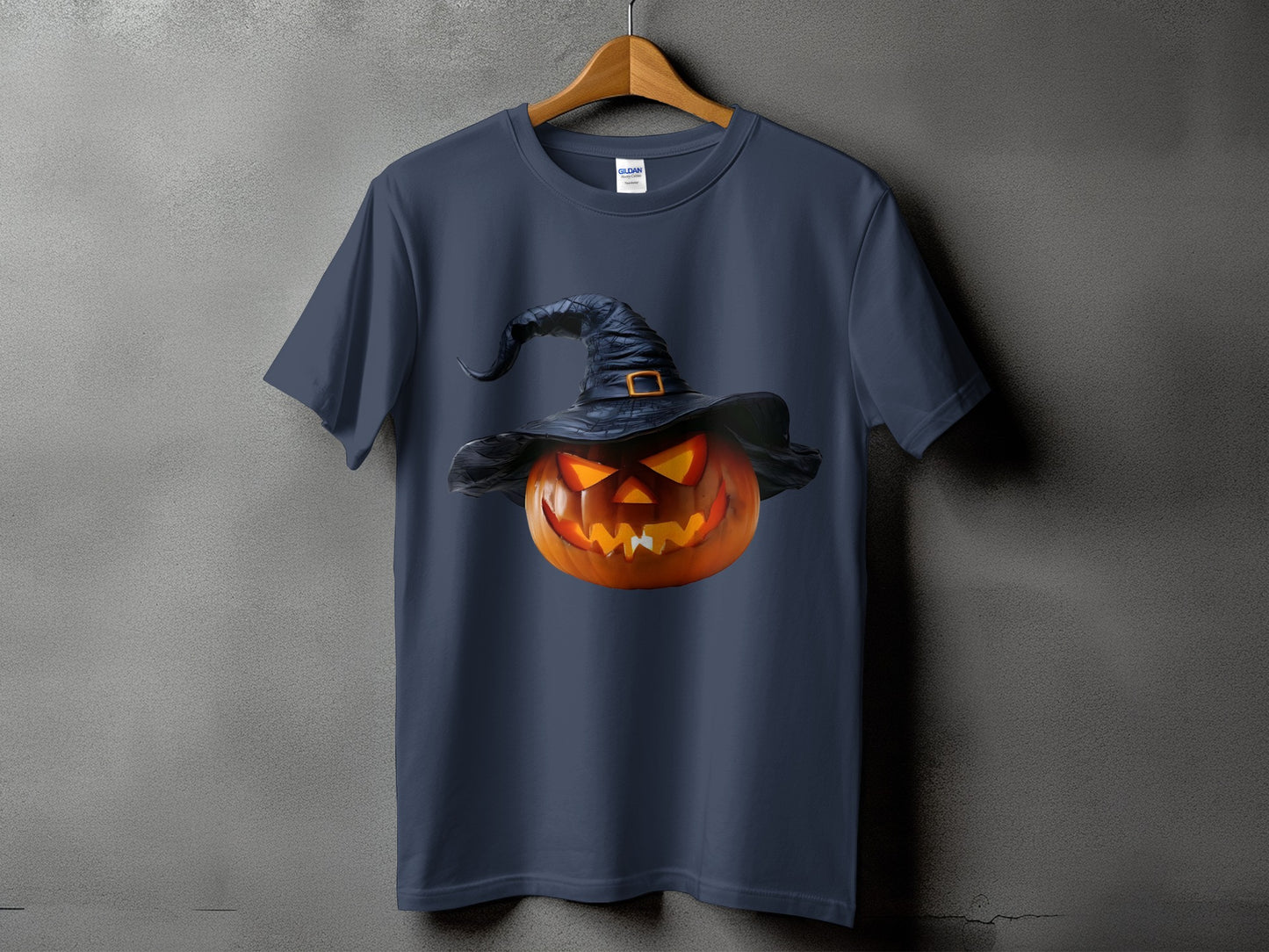 Dark blue t-shirt with a glowing jack-o'-lantern wearing a witch hat.