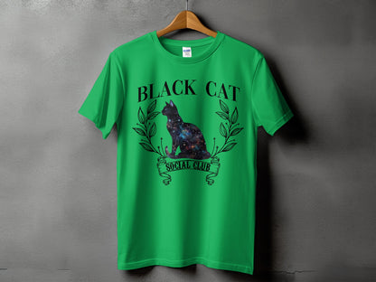 Green t-shirt with galaxy cat graphic and text "BLACK CAT SOCIAL CLUB".