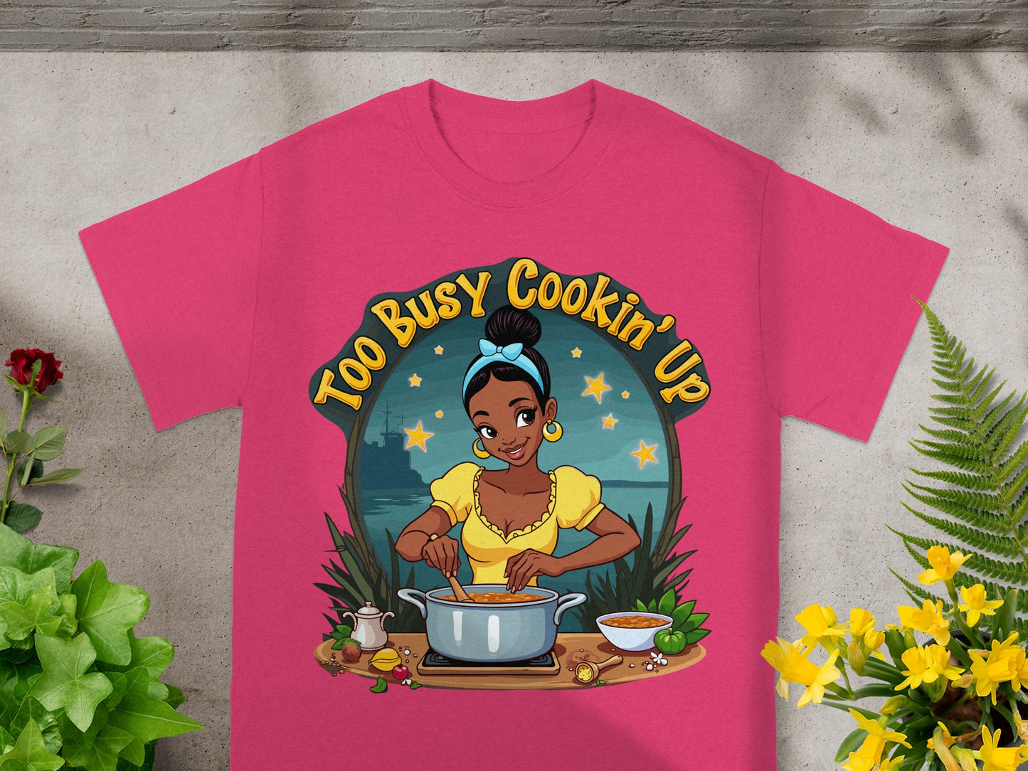 T-shirt with cartoon woman cooking, "Too Busy Cookin' Up" text.
