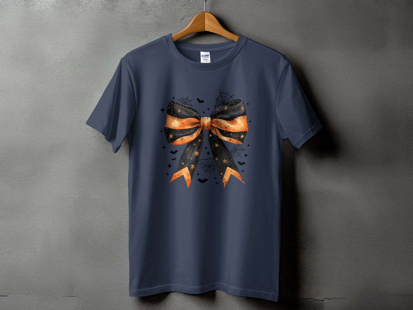 Dark navy t-shirt with Halloween bow graphic featuring bats and stars.