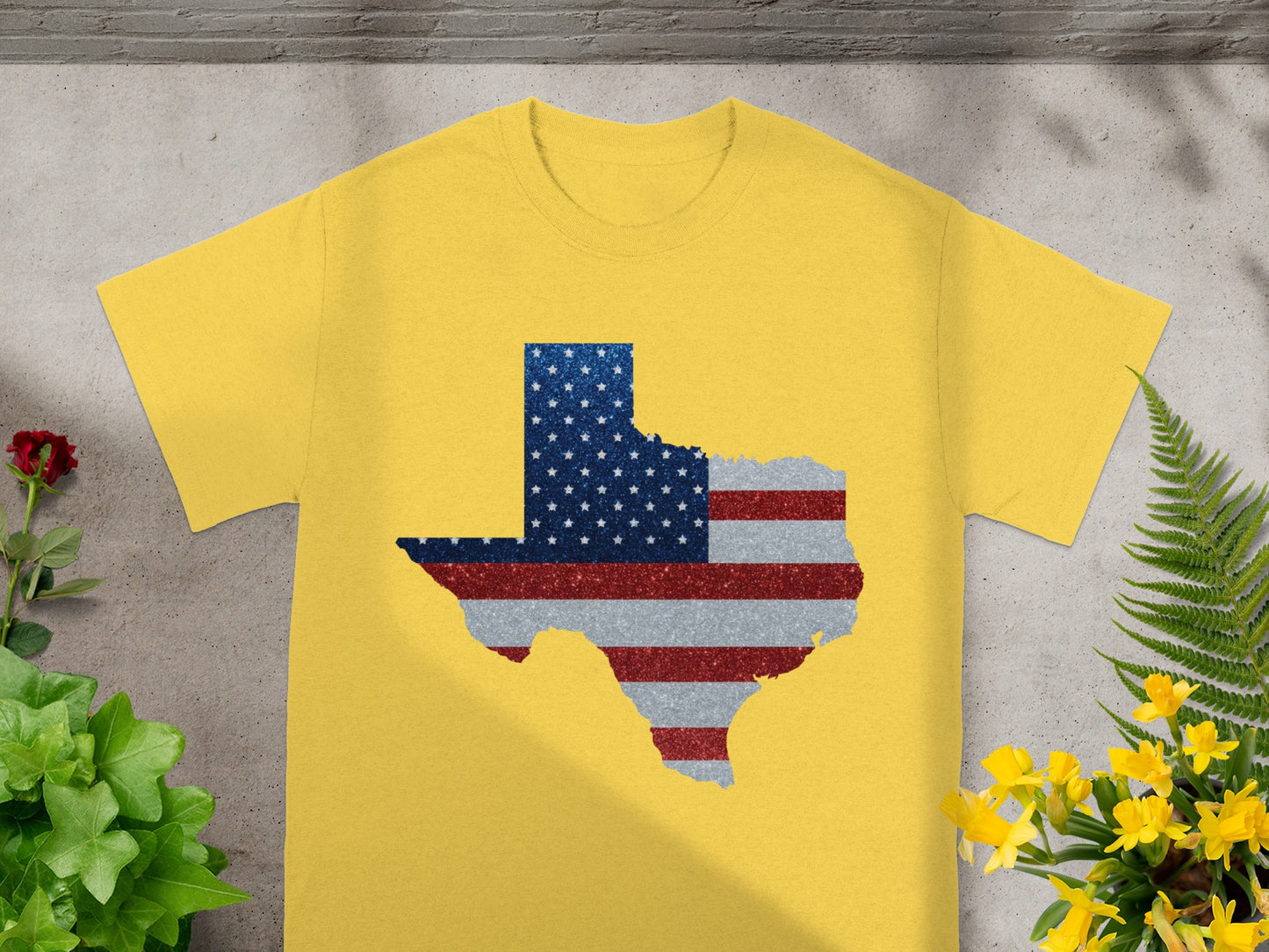Yellow t-shirt with Texas outline filled with American flag design.