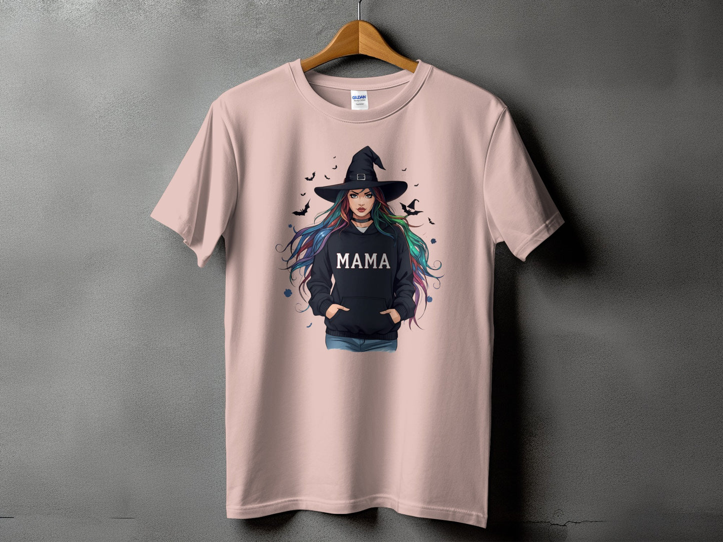 Pink t-shirt with witch graphic and the word "MAMA".