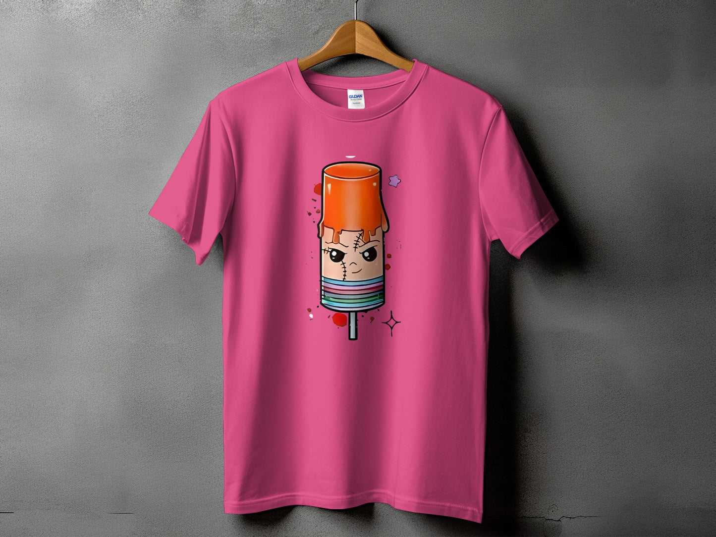 Pink t-shirt with cartoon popsicle graphic on front.