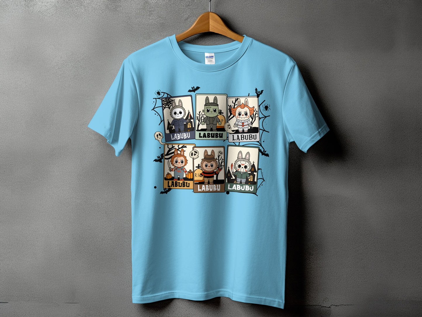 Light blue t-shirt with six Halloween-themed cartoon characters labeled "LABUBU".