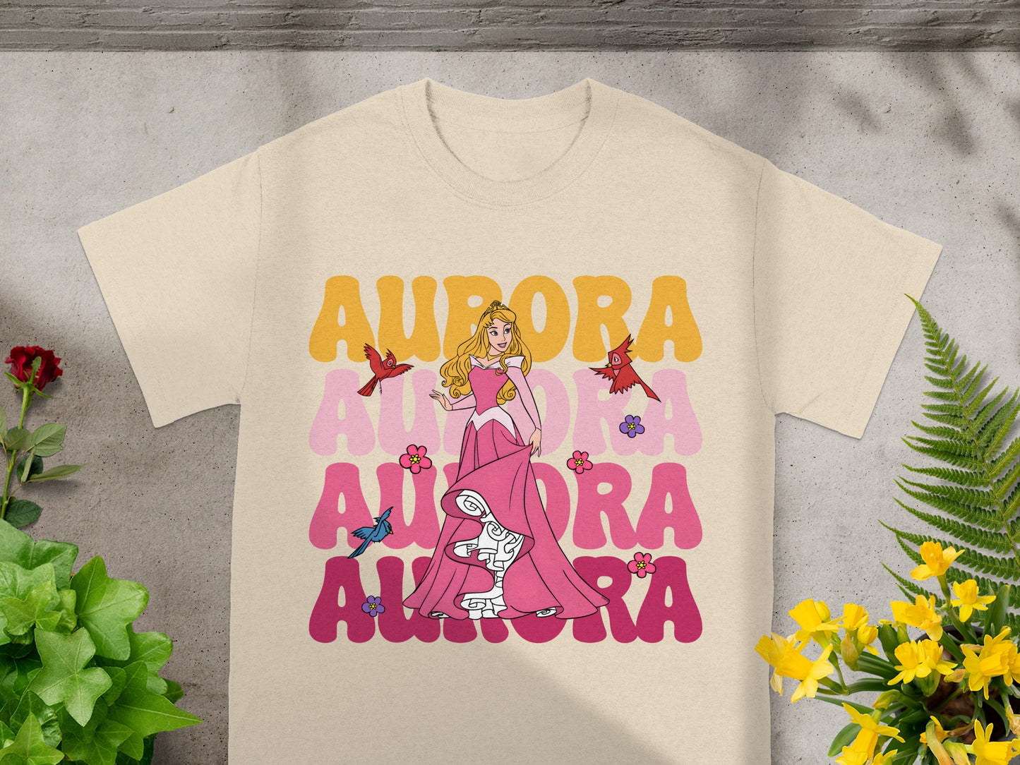 Aurora t-shirt with princess Aurora and birds, on a cream shirt.