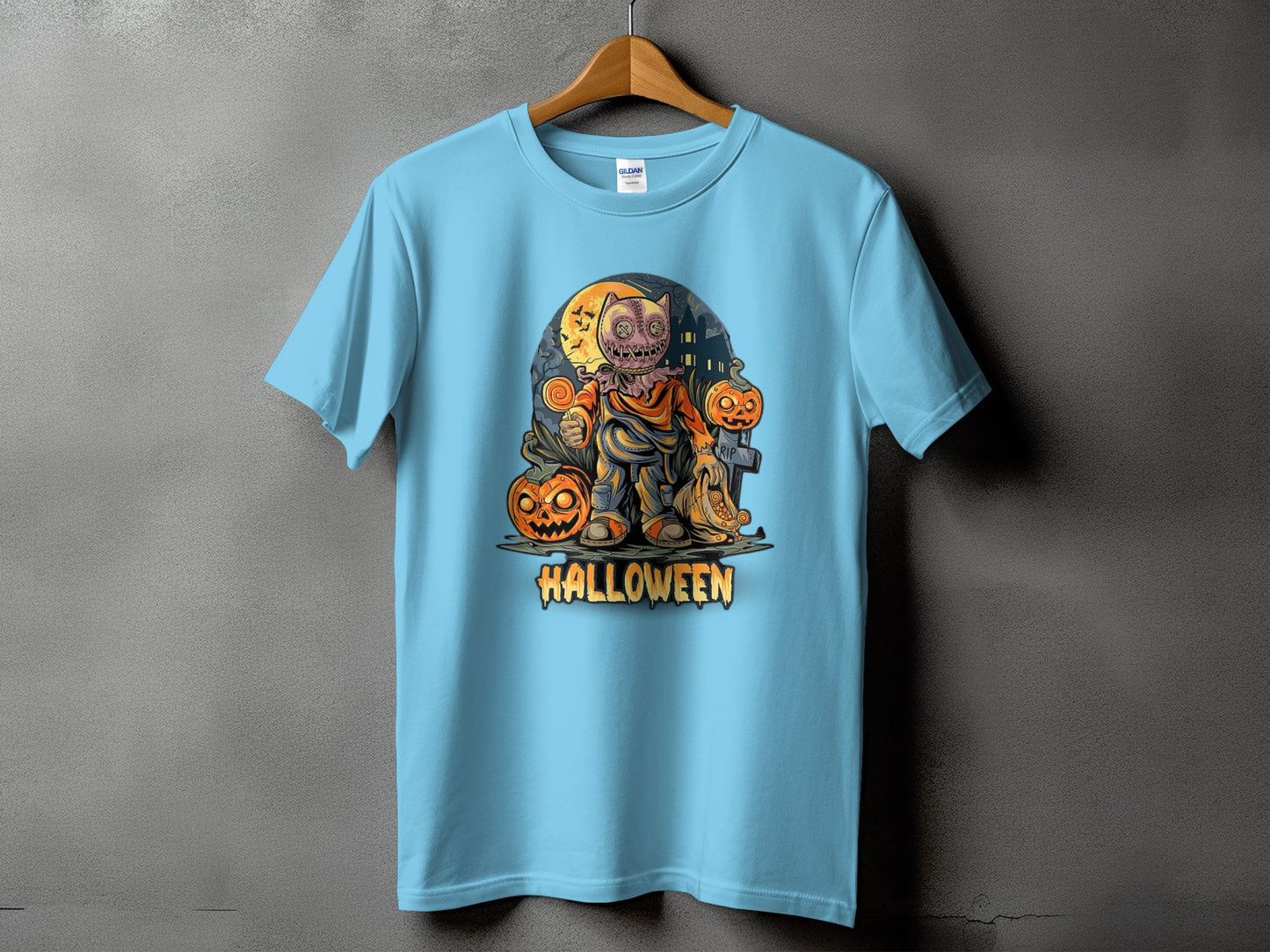 Light blue t-shirt with a Halloween design featuring a burlap sack character and pumpkins.