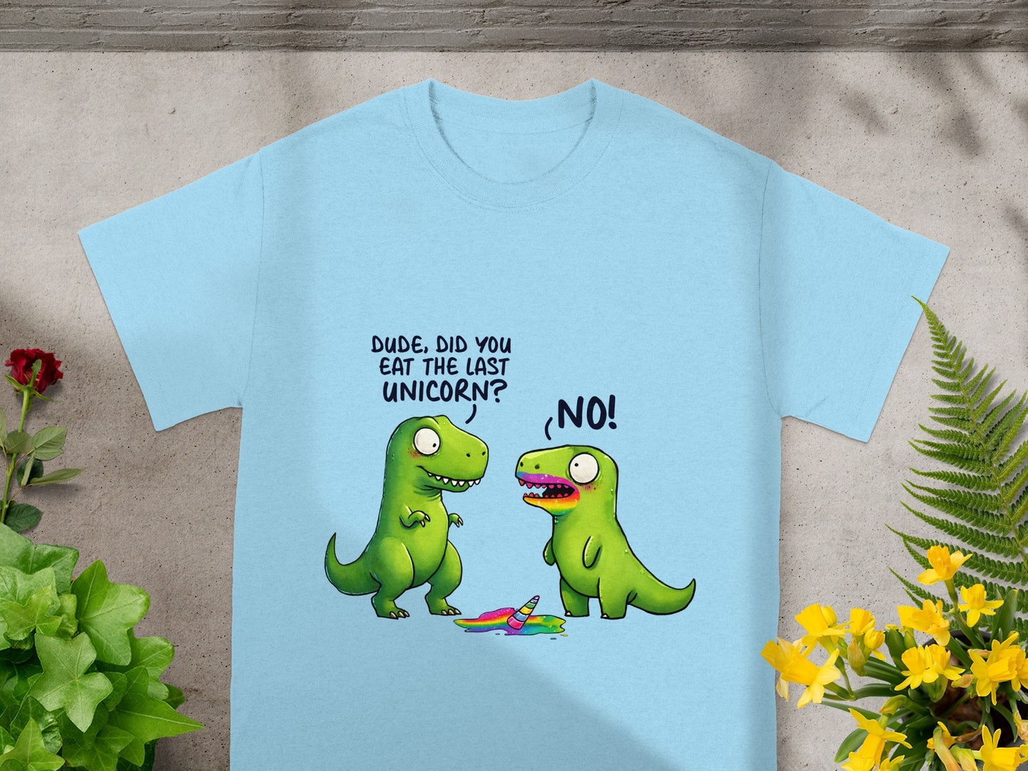 Light blue t-shirt with cartoon dinosaurs and the text "DUDE, DID YOU EAT THE LAST UNICORN? NO!"