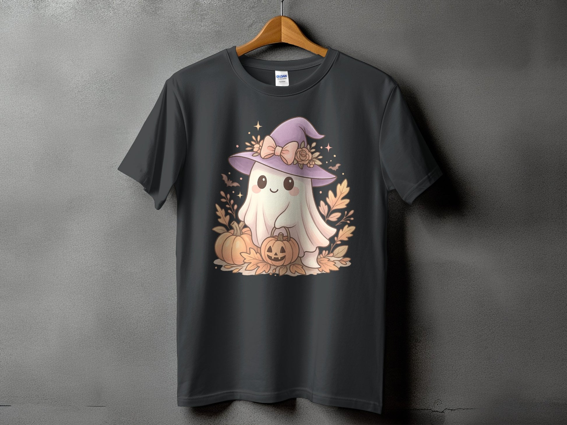 Ghost with witch hat and pumpkins graphic on a dark t-shirt.