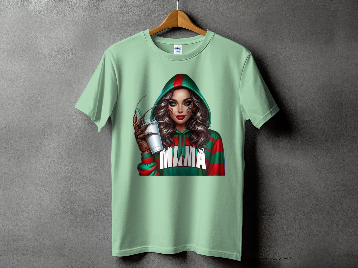 Mint t-shirt with graphic of a woman in a green and red hooded sweatshirt with "Mama" text.
