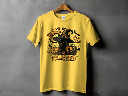 Yellow t-shirt with black cat, witch hat, pumpkins, bats, and text "BLACK CAT SOCIAL CLUB".