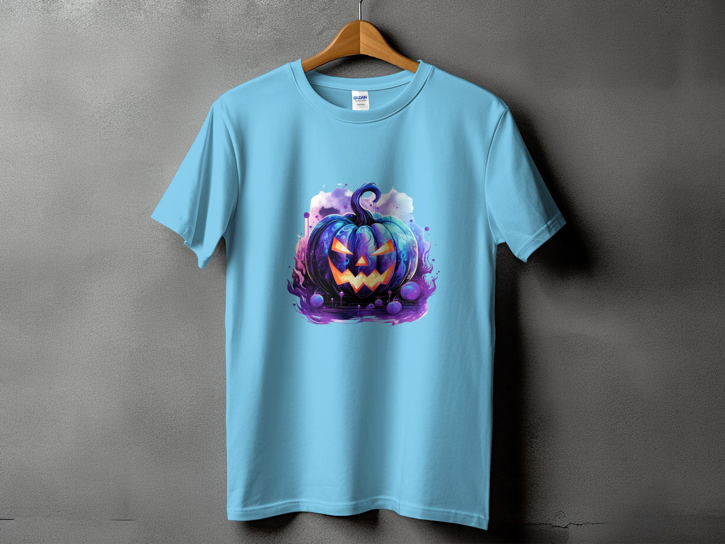 Light blue t-shirt with a spooky, vibrant jack-o'-lantern graphic on the front.