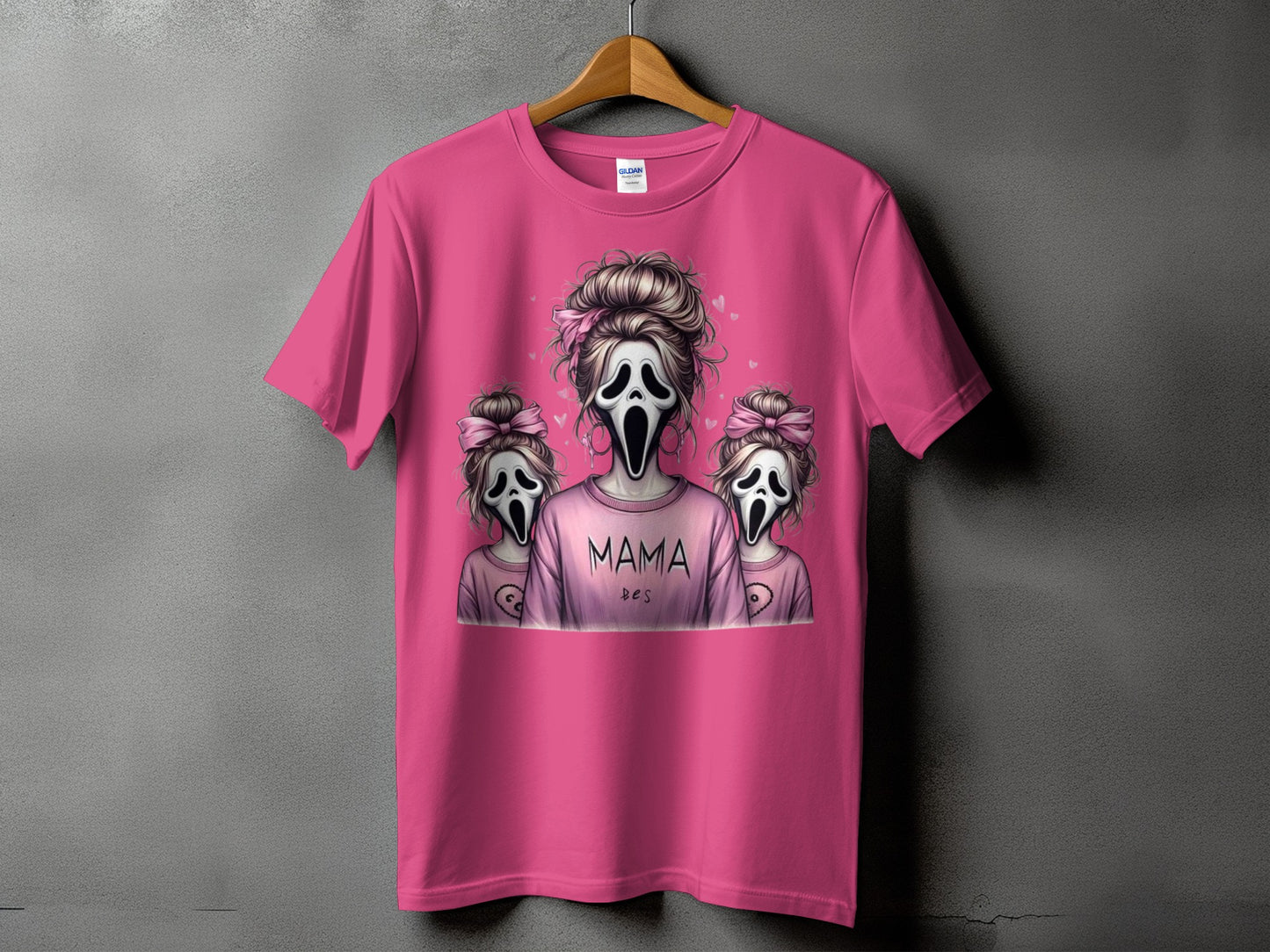Pink t-shirt with "MAMA DES" text and ghost characters.