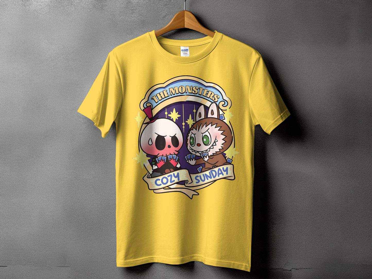 Yellow t-shirt with "The Monsters Cozy Sunday" graphic featuring cartoon monsters.