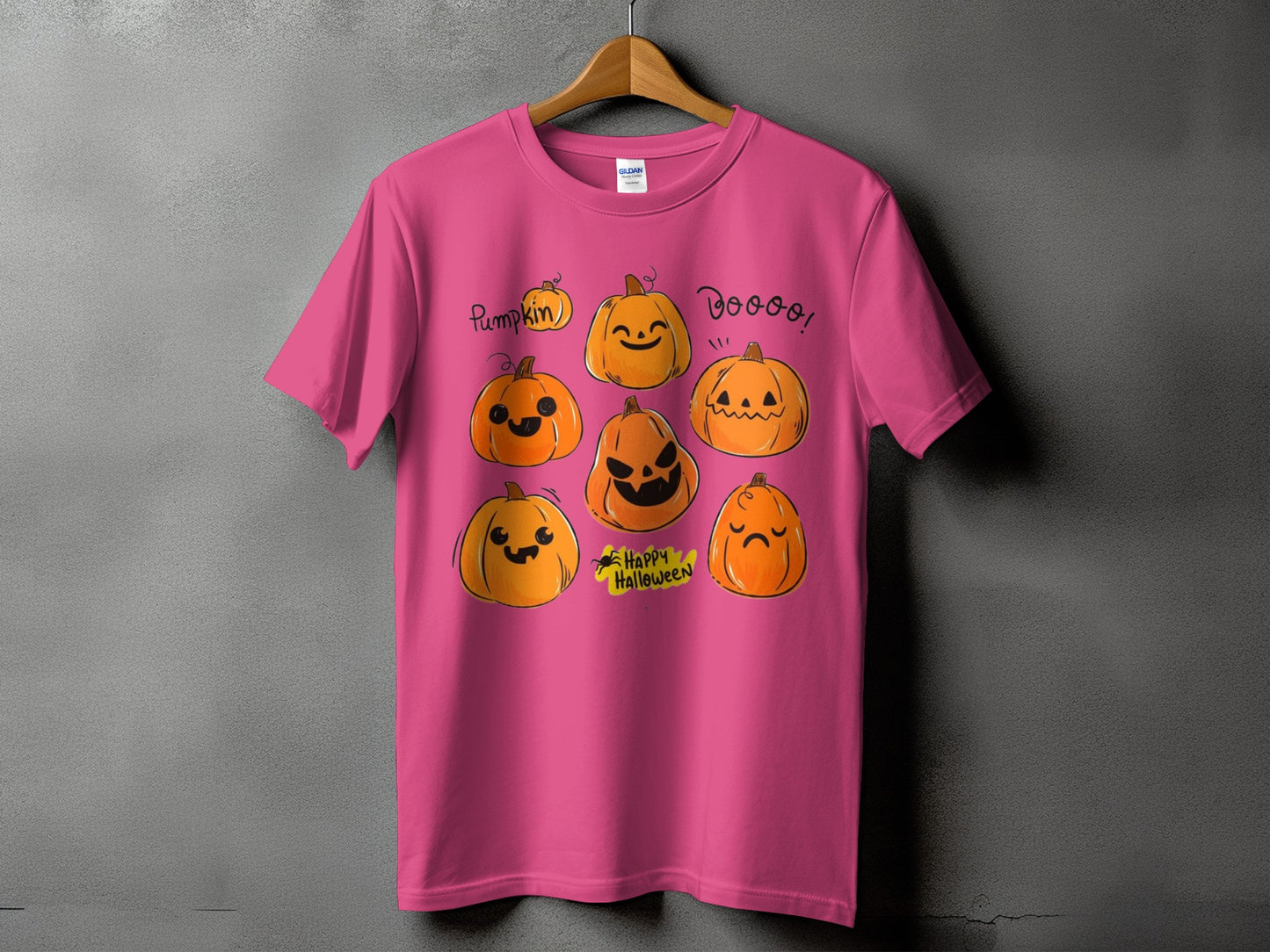 Pink t-shirt with seven cartoon pumpkins and "Happy Halloween" text.