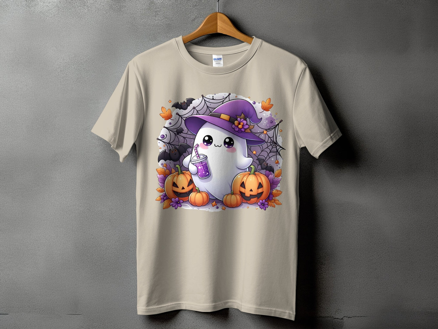 T-shirt with a kawaii ghost in a witch hat, holding a drink, surrounded by pumpkins.